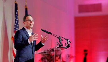 Pennsylvania Governor Josh Shapiro speaking from an podium at State-of-the-Art Pharmaceutical Manufacturing Facility