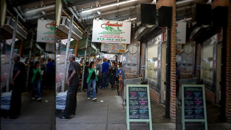 People walking in front of the entrance to Anastasi Seafood in Philadelphia