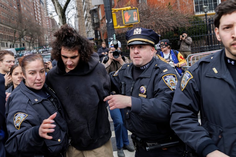 A left-wing protester is arrested after throwing what appears to be a homemade explosive device at a demonstration held by far-right influencer Jake Lang outside Gracie Mansion in New York City, on March 7, 2026. (Photo by Matthew Hoen/NurPhoto via AP)