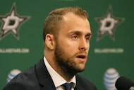 Dallas Stars' Rich Peverley talks with the media during a press conference before the...