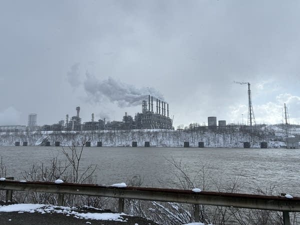 The ethane cracker in Beaver County is a giant lattice of pipes with a line of stacks billowing white plumes on one side.