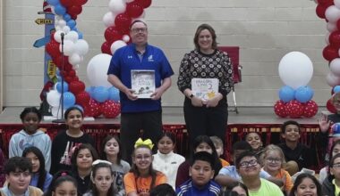 Stacy and Steve read to students in Scranton