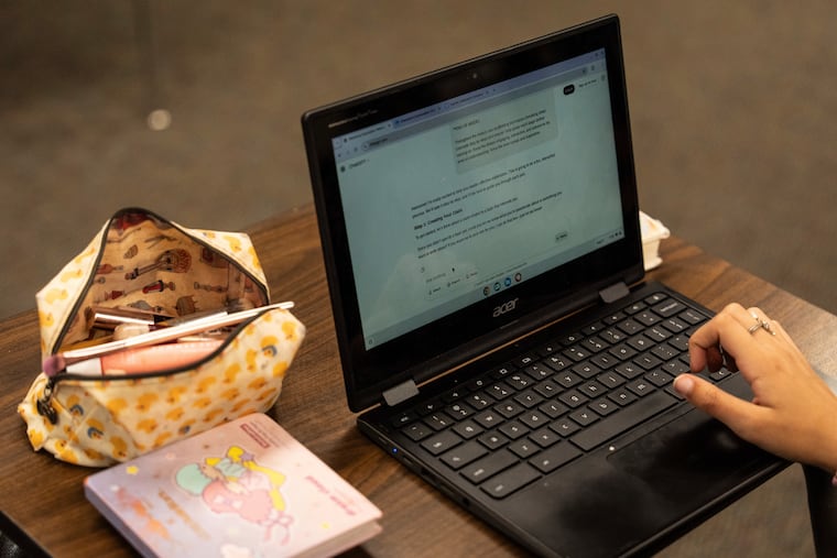 A student types a prompt into ChatGPT on a Chromebook in this Associated Press file image. Some Lower Merion parents are pushing back on Chromebook use in schools.