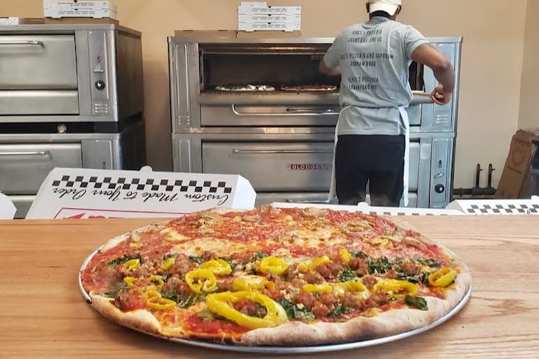 A pizza, hot from the oven, at Vince's Pizzeria, 965 Frankford Ave. in Fishtown.