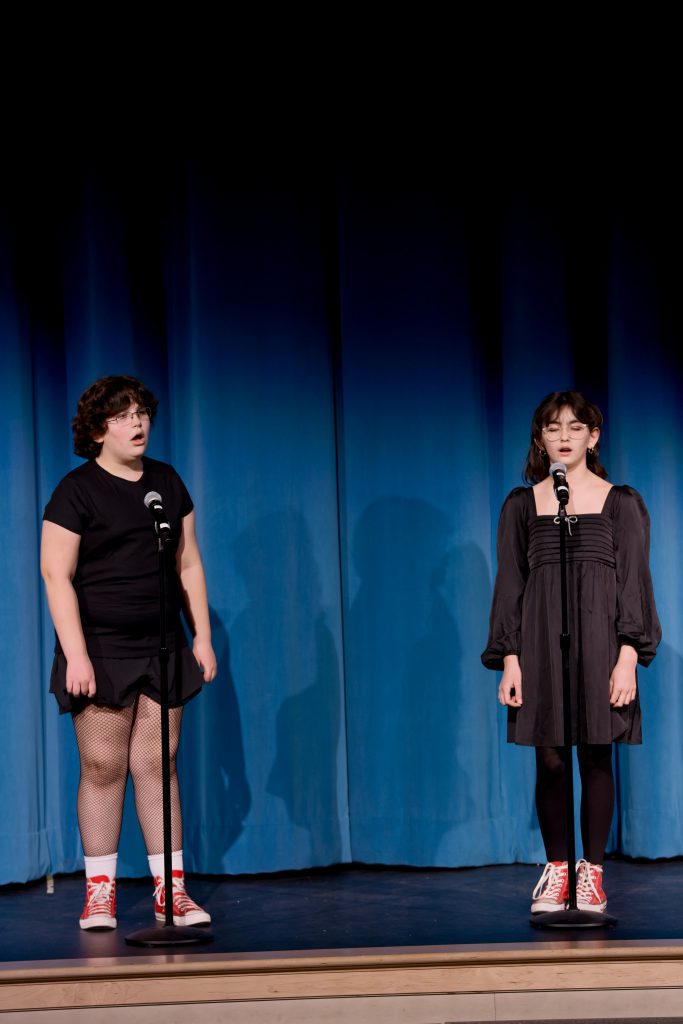 two students singing
