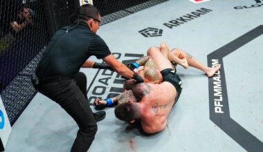 Johnny Eblen runs through Bryan Battle