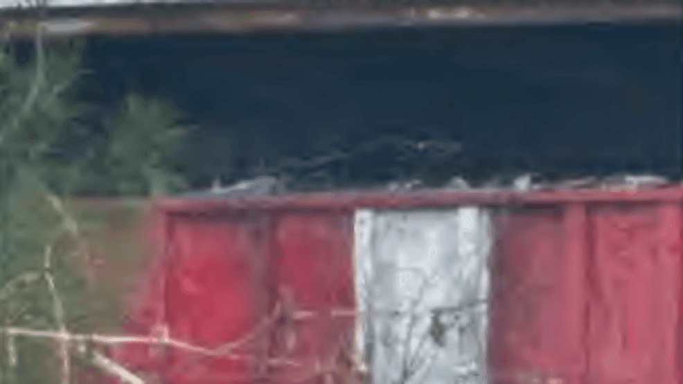 A photo submitted by DEP inspector Kalen Boyer in his inspection report. He captioned the photo, "Roll off container on the back of the roll off truck entering the Site. Scrap metal is sticking above the sides of the container."{ }{p}{/p}{p}{/p}{p}{/p}