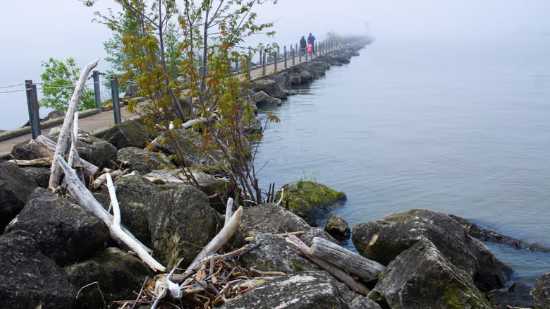 A family walking on a long pier at Lorain in Ohio