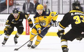 Erie Otters' Evan Headrick (81) is pursued by Sarnia Sting's Ben Pickell (12) and Kaden Aucoin (33) at Progressive Auto Sales Arena in Sarnia, Ont., on Wednesday, March 18, 2026. Mark Malone/Chatham Daily News/Postmedia Network