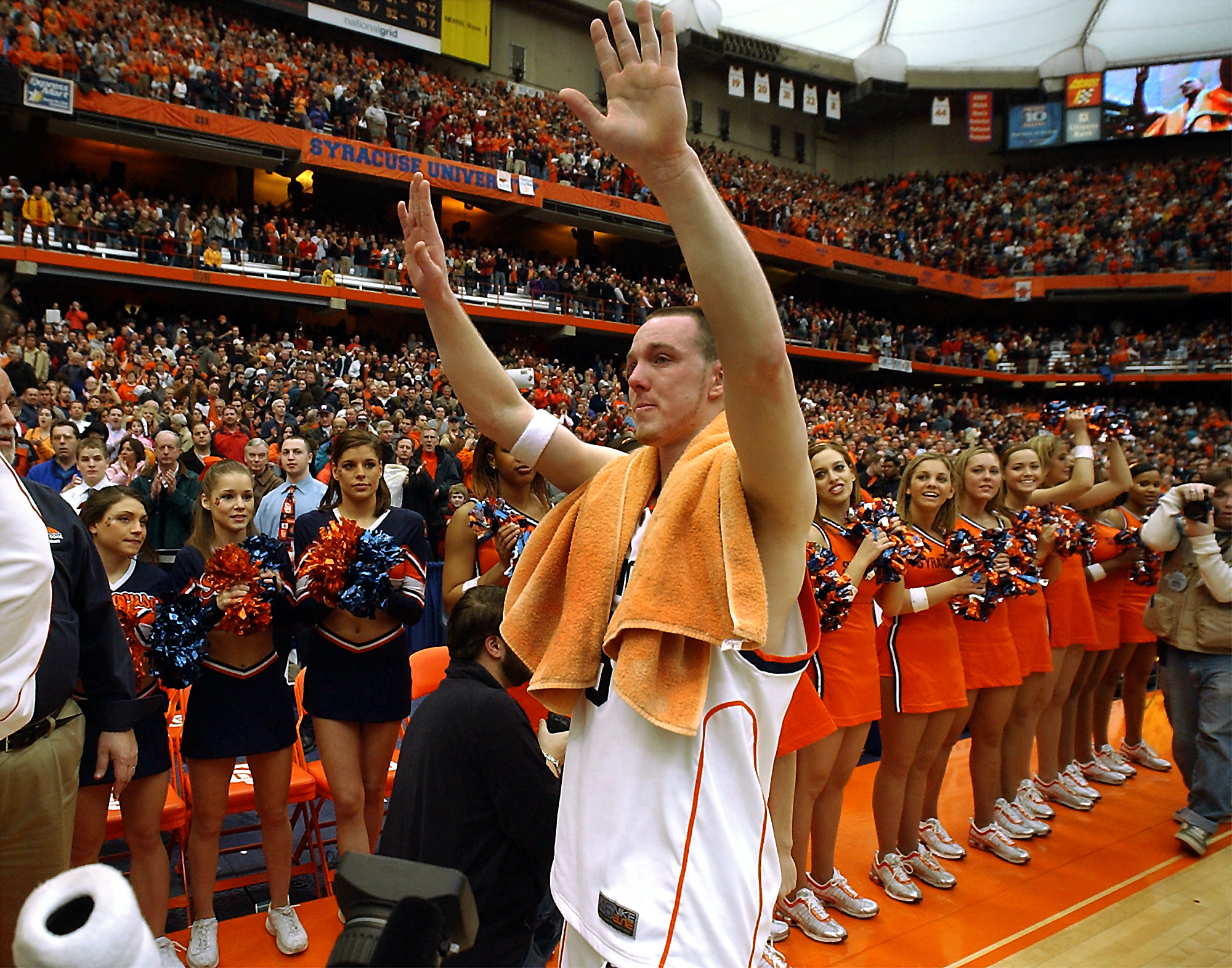 Gerry McNamara waves to the fans as he walks off...