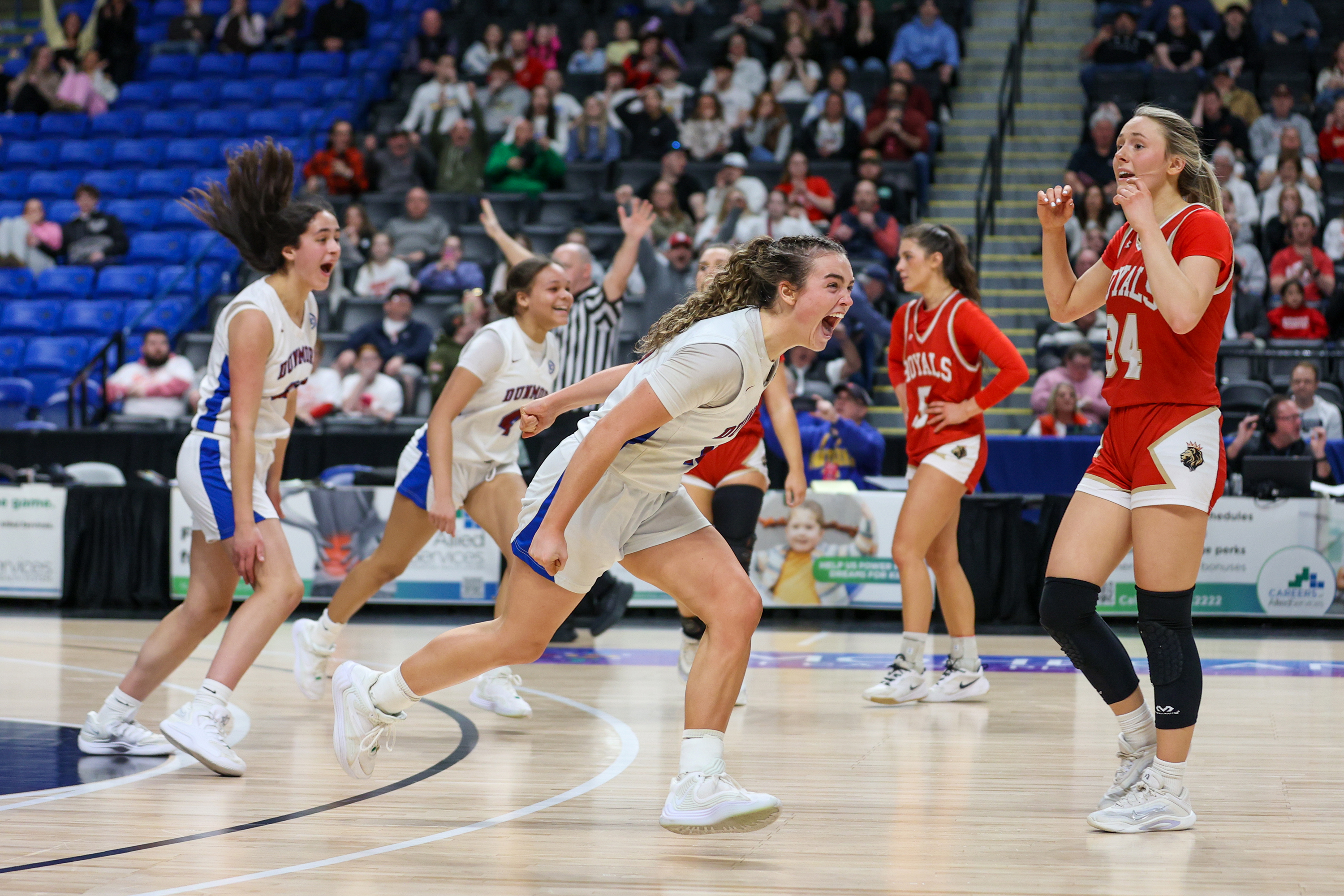 Dunmore’s Amanda Dempsey (10) celebrates after winning the District 2...