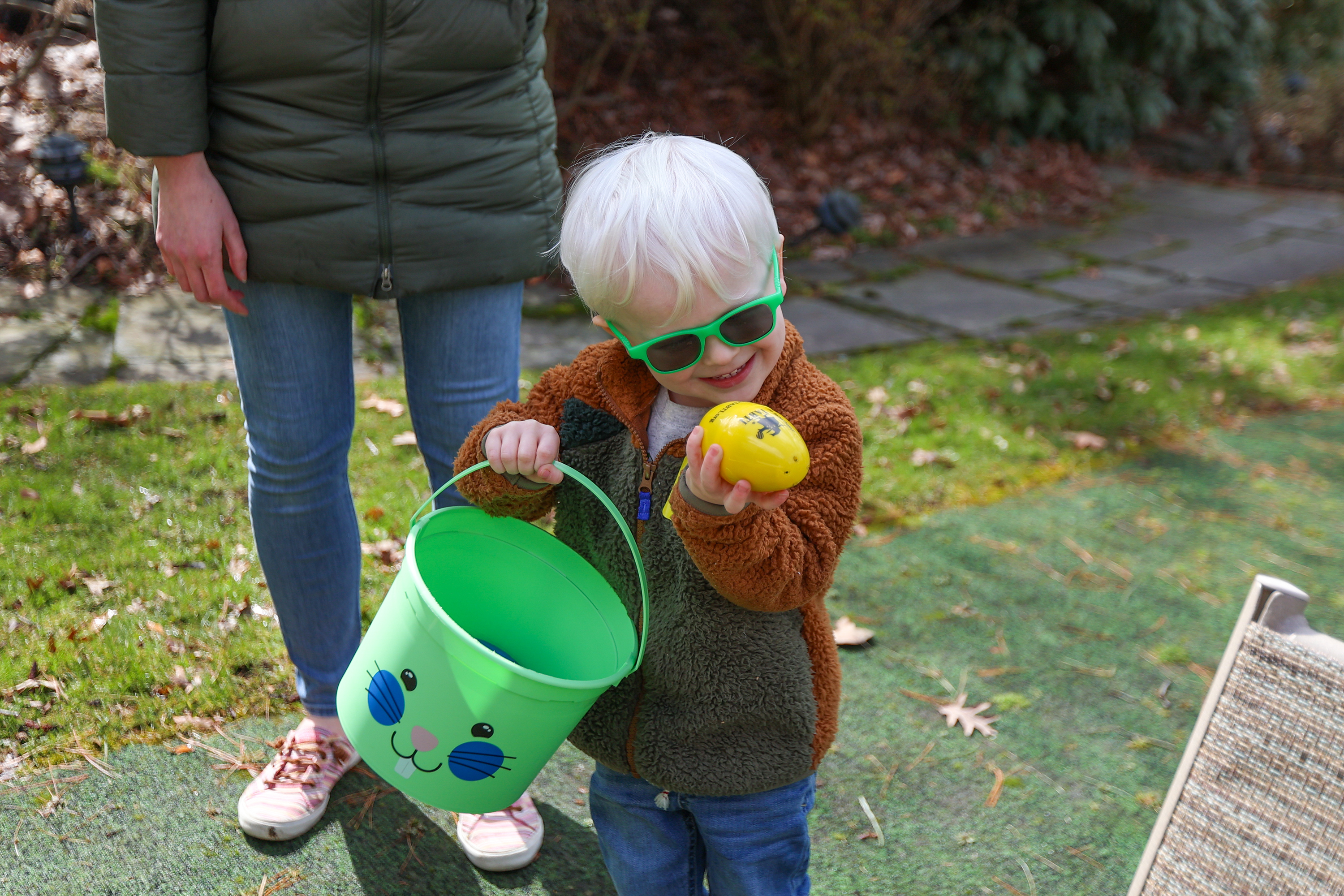 Hudson Ruseskas, 4, of Swoyersville, examines an egg he found...