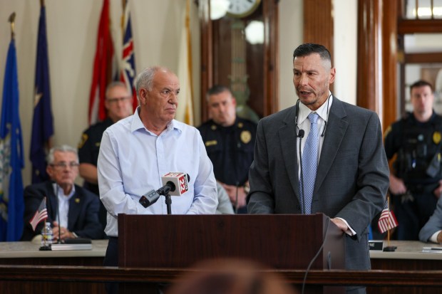 Sam Syla, left, and George Albert describe their plans during the unveiling of a new hotel on 46 Public Square on Thursday, May 15, 2025. (JASON ARDAN / STAFF PHOTOGRAPHER)