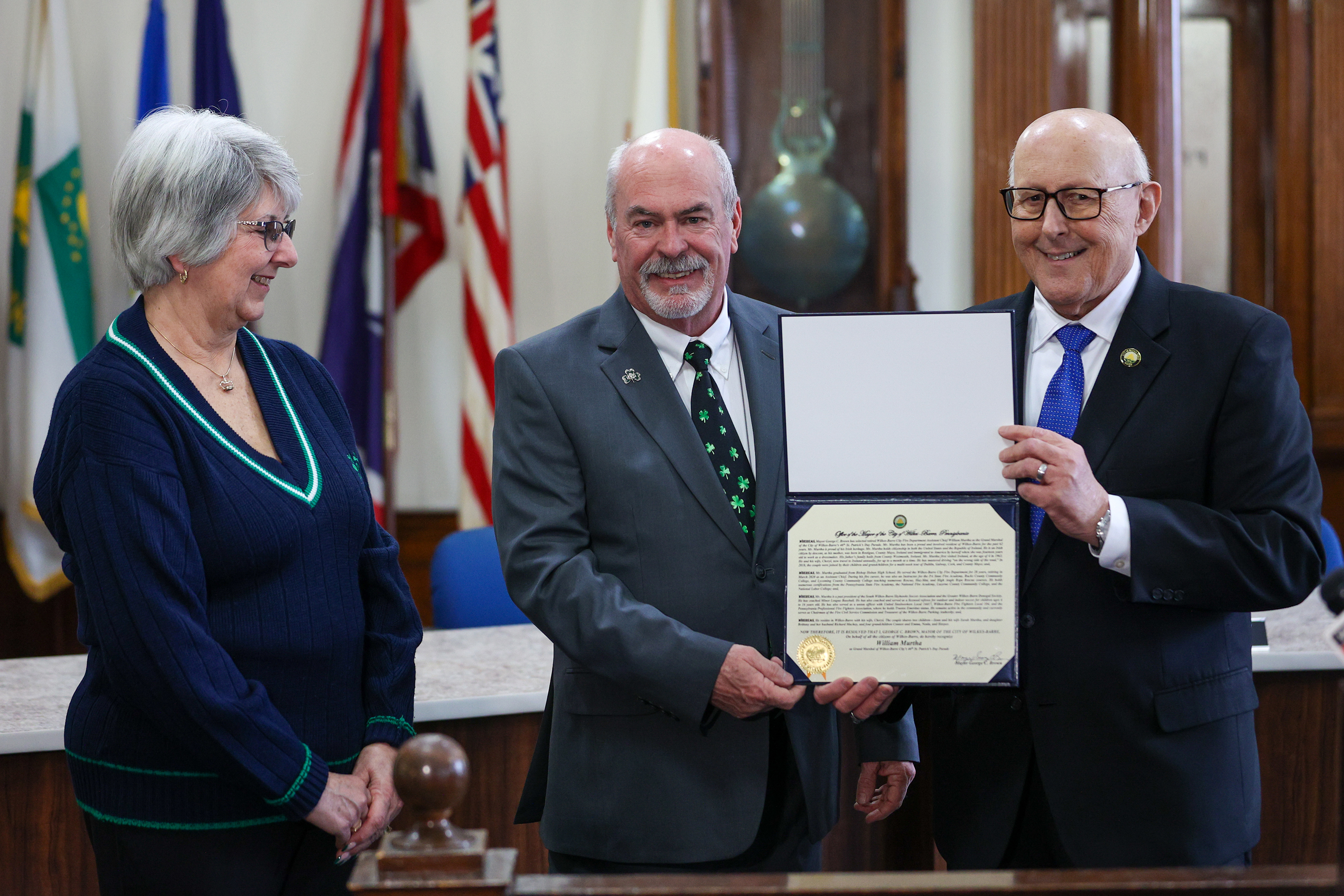 Cheryl Murtha looks on as her husband, William Murtha, left,...