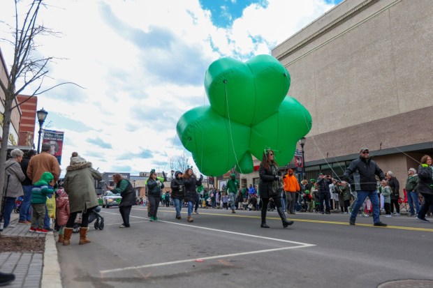 A three-leaf clover floats in the Wilkes-Barre St. Patrick's Day Parade on Sunday, March 9, 2025. (JASON ARDAN / STAFF PHOTOGRAPHER)