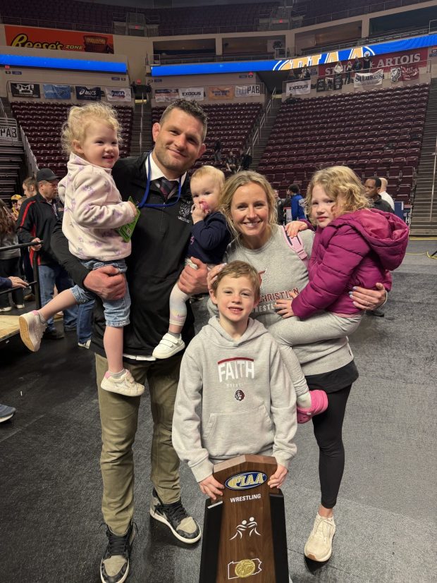 Ben Clymer, wife Kailey and their four children celebrate another PIAA Wrestling Championships ending. (Photo courtesy of Kailey Clymer)