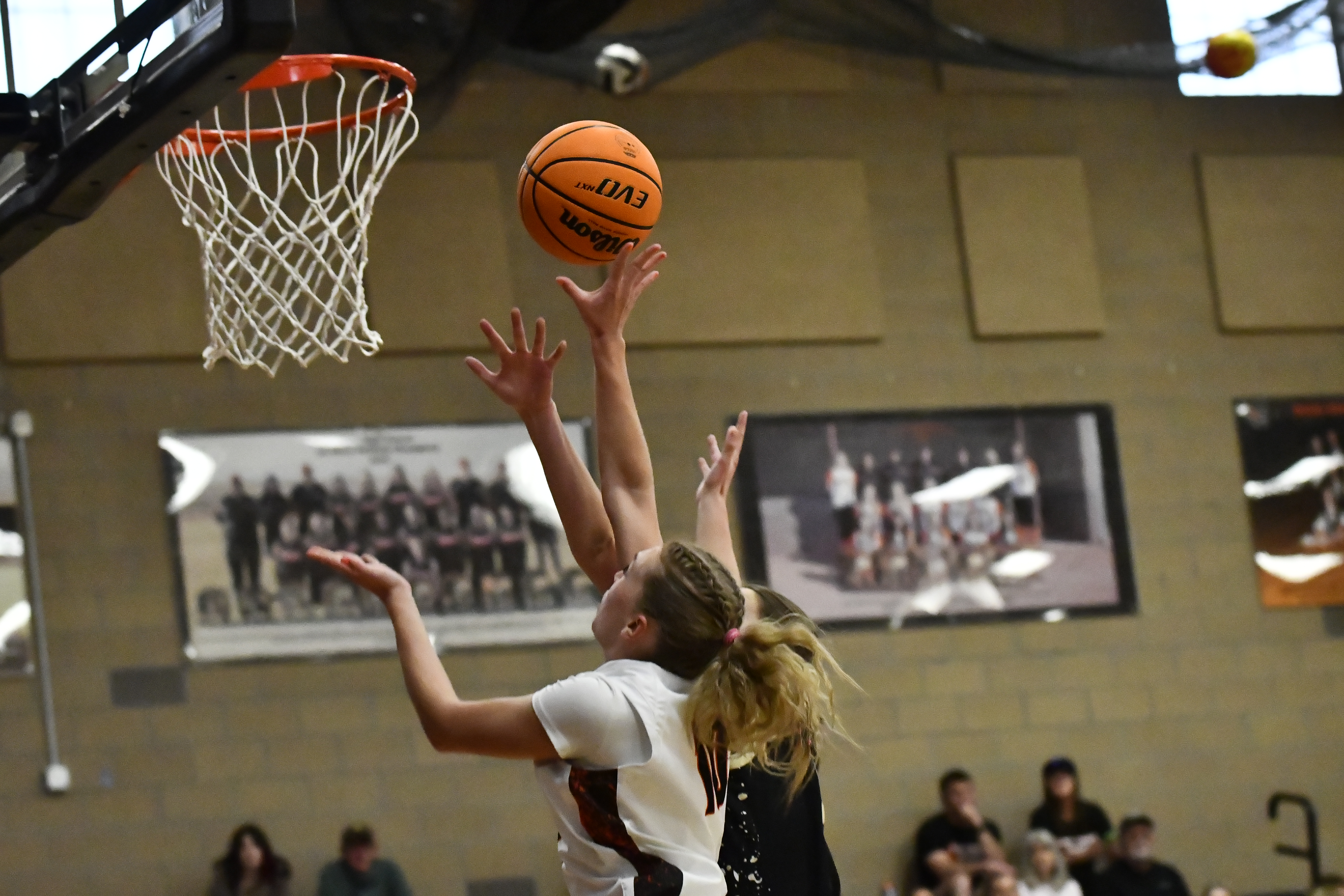Erie's Juliet Slater takes a layup with pressure from Rock...