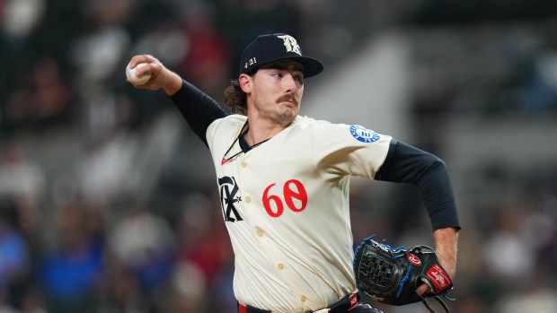 Texas Rangers pitcher Cole Winn throws to the Miami Marlins during the 11th inning of a baseball game Friday, Sept. 19, 2025, in Arlington, Texas. (AP Photo/Julio Cortez)