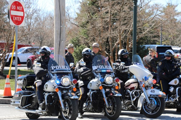 People depart from the funeral mass. The funeral mass was open to only immediate and extended family, loved ones. Additionally, the Pennsylvania State Police showcased a massive presence to honor Corporal Timothy O'Connor and were joined by elected officials, municipal and regional police forces across Chester County, as well as law enforcement representatives from across America. (Jen Samuel Daily Local News)