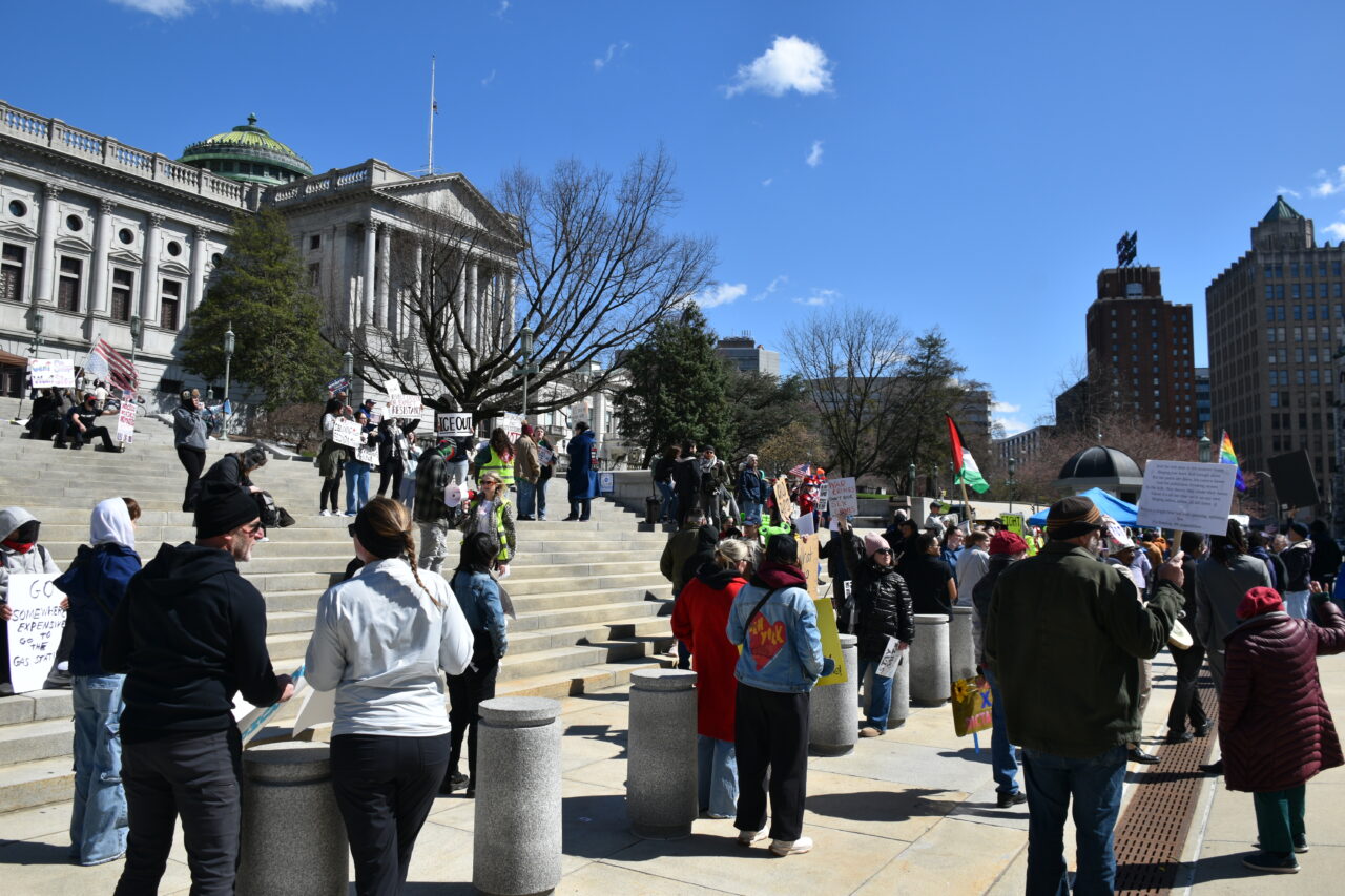 About a hundred protesters stuck around to chant about Trump's connection to convicted sex offender Jeffrey Epstein after the speeches and march at the Capitol in Harrisburg, Pa, on March 28.