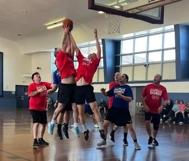 The Upper Darby police and firefighters teams battle for the ball at the third annual Battle of the Badges on Saturday. (COURTESY OF LISA FARAGLIA)