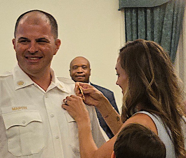 Upper Darby Fire Chief Nicholas Martin has his new chief badge pinned on by his wife, Emily. (COURTESY PHOTO)
