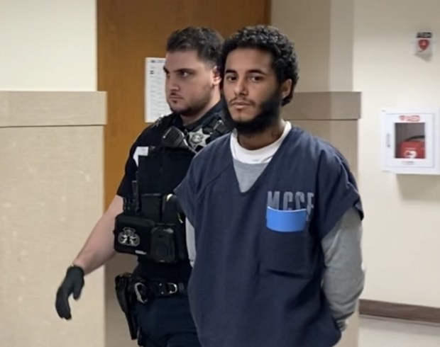 Jesus DeJesus of Philadelphia is escorted by a deputy sheriff from a Montgomery County courtroom to begin his prison term. (Photo by Carl Hessler Jr. - MediaNews Group)