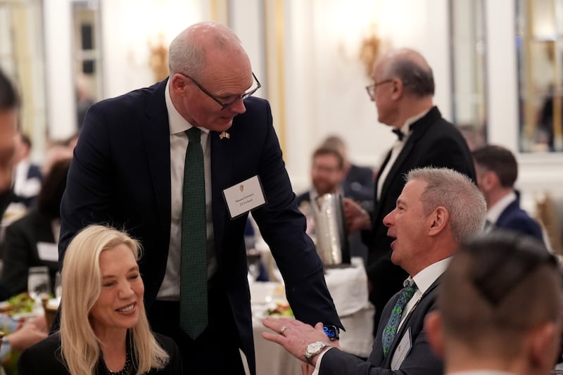 Former tánaiste and minister for foreign affairs Simon Coveney (left) speaks with Edward Walsh, the US ambassador to Ireland, at the St Patrick's Day Business Leaders Luncheon in Washington on Monday. Photograph: Niall Carson/PA