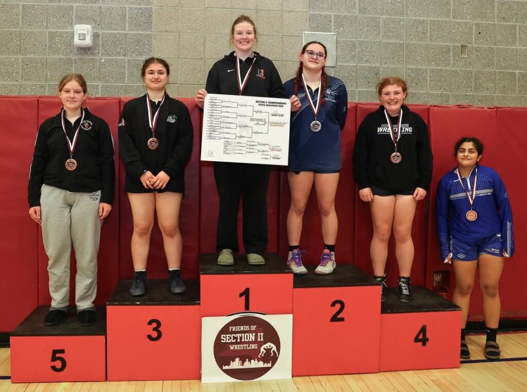 five student on a podium