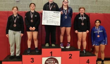 five student on a podium