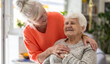 Preparation for blood test with senior woman by female doctor medical uniform on the table in white bright room. Nurse pierces the patient’s arm vein with needle blank tube.