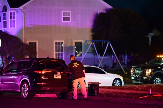 FBI Evidence Response Team agents collect evidence while executing a search warrant at a home associated with an 18-year-old suspect in Langhorne, Pennsylvania, on March 8, 2026. (Photo by Kyle Mazza/Anadolu via Getty Images)