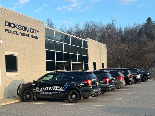 Police vehicles are seen here parked outside the Dickson City Municipal Building on Tuesday, March 10, 2026. (JEFF HORVATH/STAFF PHOTO)