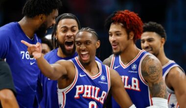 Sixers guard Tyrese Maxey celebrates with his teammates after dunking over Charlotte Hornets forward Miles Bridges.