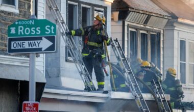 Firefighters respond to a two-alarm rowhouse fire on the 500 block of High Street in East Germantown on Tuesday.