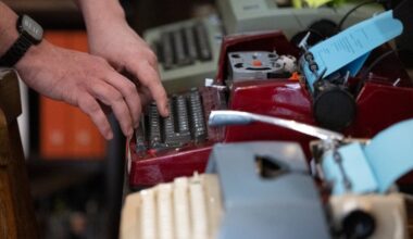 Bill Rhoda types on a vintage typewriter at his shop, Philly Typewriter, on Friday, Jan. 9, 2026, in Philadelphia. A recent customer flew a typewriter to the city for an extensive repair.