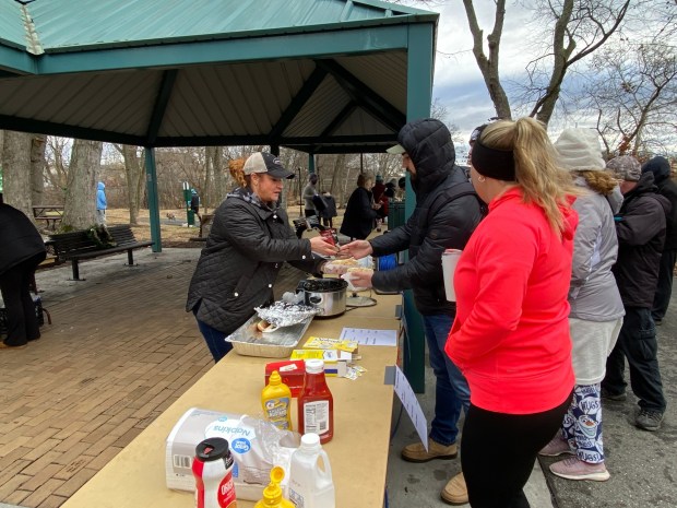 Each year, Andie Graham, program director for the Pottstown Parks and Recreation Department, serves up pork hot dogs and sauerkraut as part of the Polar Bear Plunge annual tradition. (MediaNews Group File Photo)