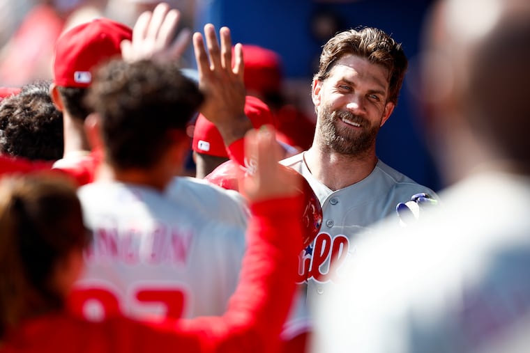 Phillies first baseman Bryce Harper celebrates his fifth-inning home run against the Toronto Blue Jays on Saturday at TD Ballpark in Dunedin, Fla.