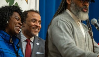 Mayor Cherelle L. Parker is with school superintendent Tony B. Watlington, Sr. (center) at McDaniel Elementary School Monday, March 23, 2026 as Reginald Streater, president of the Board of Education speaks during announcement of the Mayor’s proposed $1-per-ride Uber and Lyft tax to help bail the Philadelphia School District out of a budget deficit.