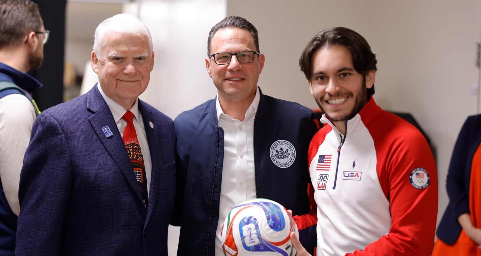 Group photo of Governor Josh Shapiro, soccer player and Host City Executive & CEO at FIFA World Cup Fan Zones event