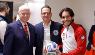 Group photo of Governor Josh Shapiro, soccer player and Host City Executive & CEO at FIFA World Cup Fan Zones event