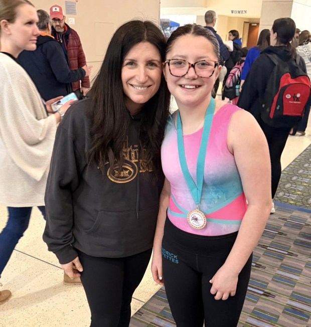 Spirited Cadence Garcia had plenty of support from mom Michelle during her first season with Kendrick Gymnastics. (Submitted photo)