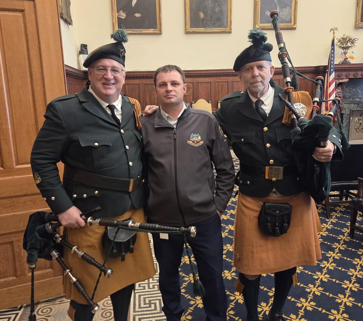 Ubiquitous James Doughery buddies up to two bagpipers at the...