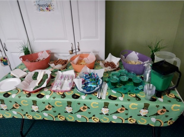Residents got to fill their plates with goodies and non-alcoholic green beer before pow-wowing together. (Photo courtesy of Roxborough Home For Women)