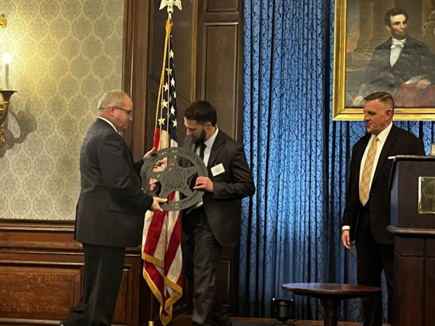 Exeter Township Detective Anthony Pendell receives a National Computer Forensic Institute certificate in Hoover, Ala., on Dec. 4. The award presented by the U. S. Secret Service Cyber Task Force recognizes the most prolific investigators in the nation for complex cyber and fraud cases over the previous year. (COURTESY OF EXETER TOWNSHIP POLICE DEPARTMENT)