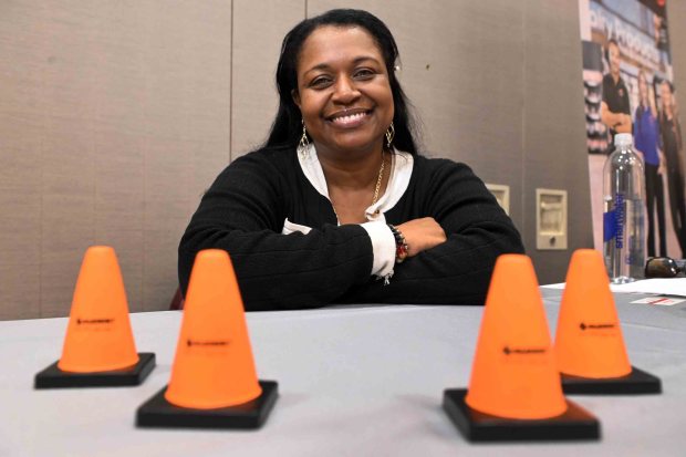 Ruth Besson, human resources manager, greets applicants for work at Summit Flagging. (BILL UHRICH/READING EAGLE)