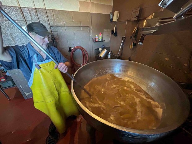 Edwin Kutz of Kempton stirs broth in the scrapple pot at Dietrich's Meats and Country Store in Krumsville, Greenwich Township. (BILL UHRICH/READING EAGLE)