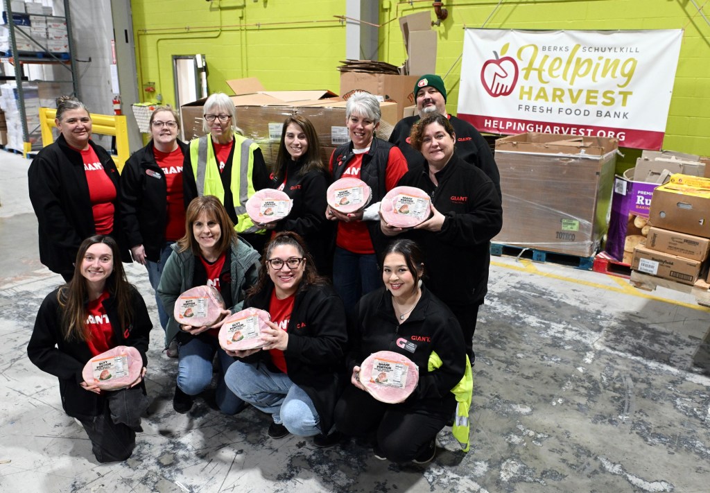 Giant donates 200 hams to Helping Harvest for Easter distribution