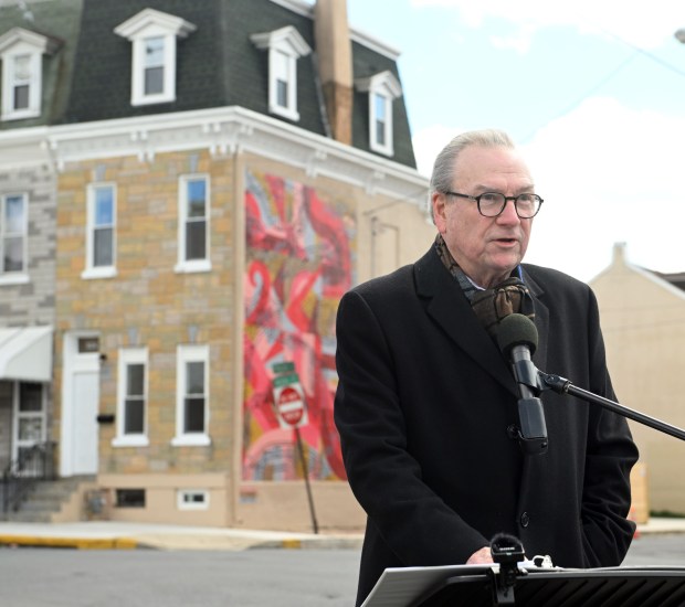 Habitat Executive Director Timothy J. Daley says the dedication of a Habitat home in the 900 block of Douglass Street represents what can happen when organizations, schools, volunteers and residents work together. (BILL UHRICH/READING EAGLE)