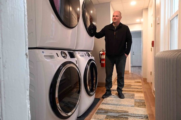 Hope Rescue Mission CEO Robert Turchi looks over the laundry at the mission's community housing at 131-133 S. Ninth St. (BILL UHRICH/READING EAGLE)